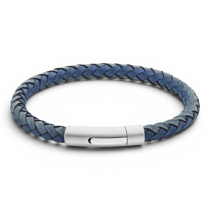 Navy and antique blue braided leather bracelet with stainless steel clasp on a white background