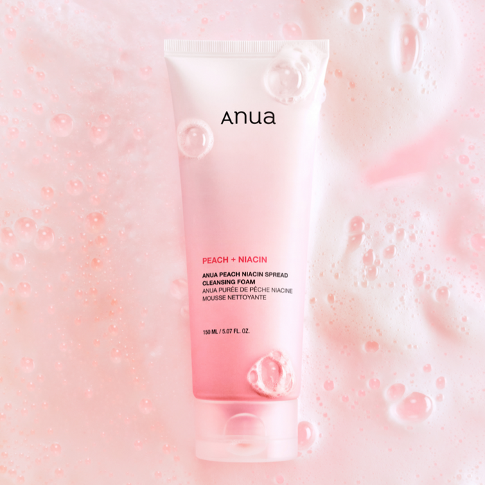 ANUA Peach Niacin Spread Cleansing Foam 150ml with pink bubbles background
