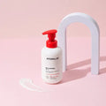 ATOPALM MLE Lotion 300ml bottle on pink background with lotion swatch