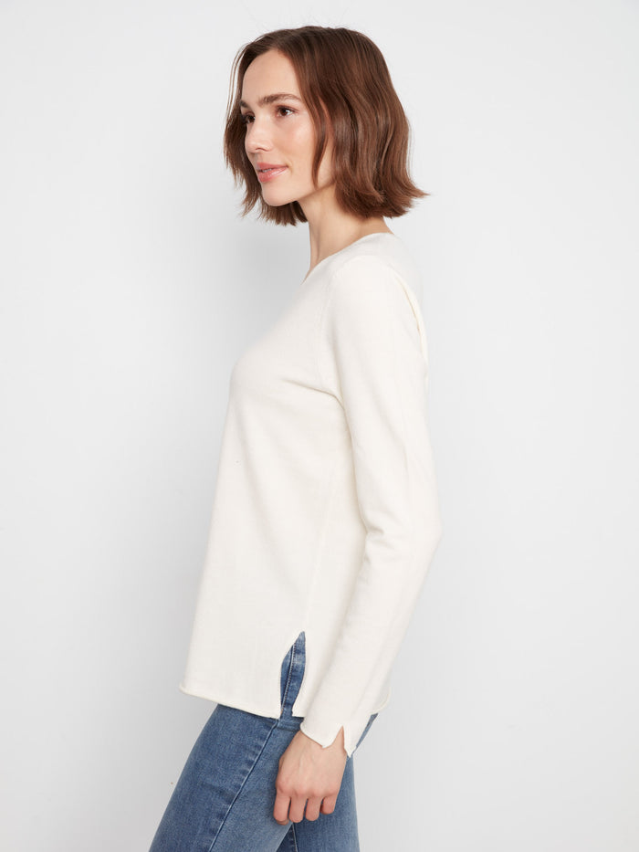 Chic side slits add a stylish touch to this versatile long sleeve top. By Charlie B.
