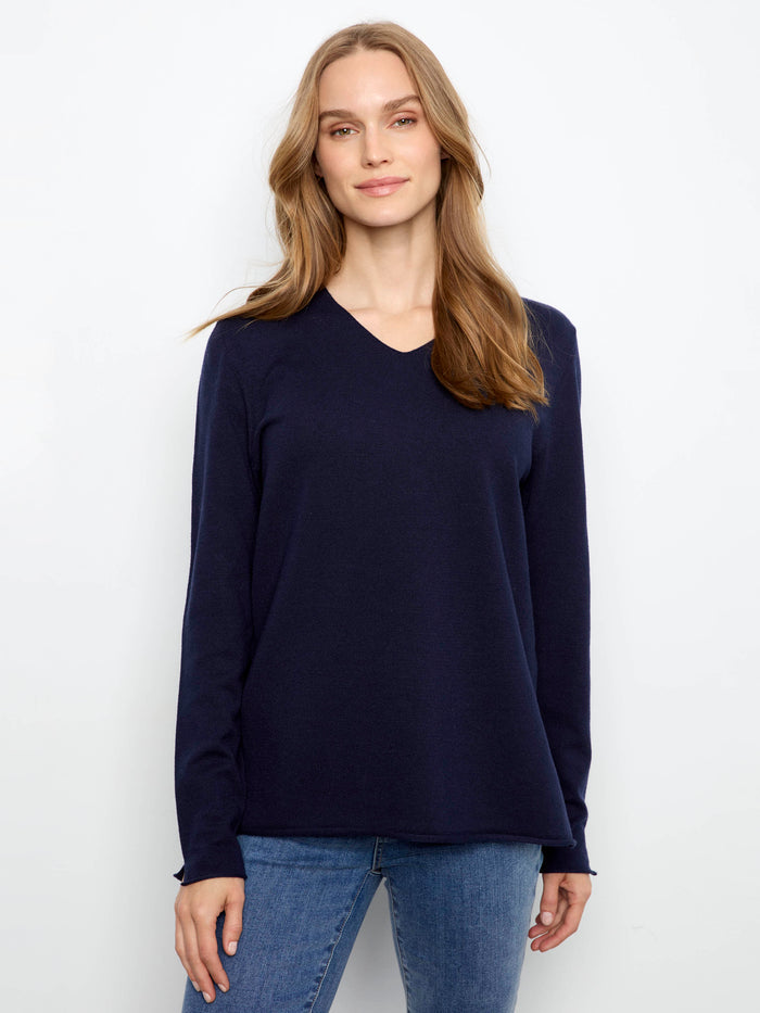 Elegant top featuring a flattering V-neckline, perfect for any occasion. Crafted with care and style by Charlie B.