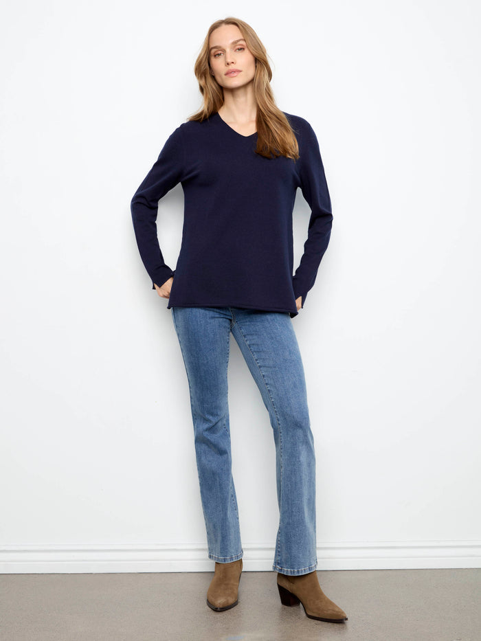 This stylish piece boasts long sleeves, offering both comfort and sophistication. A timeless design by Charlie B.