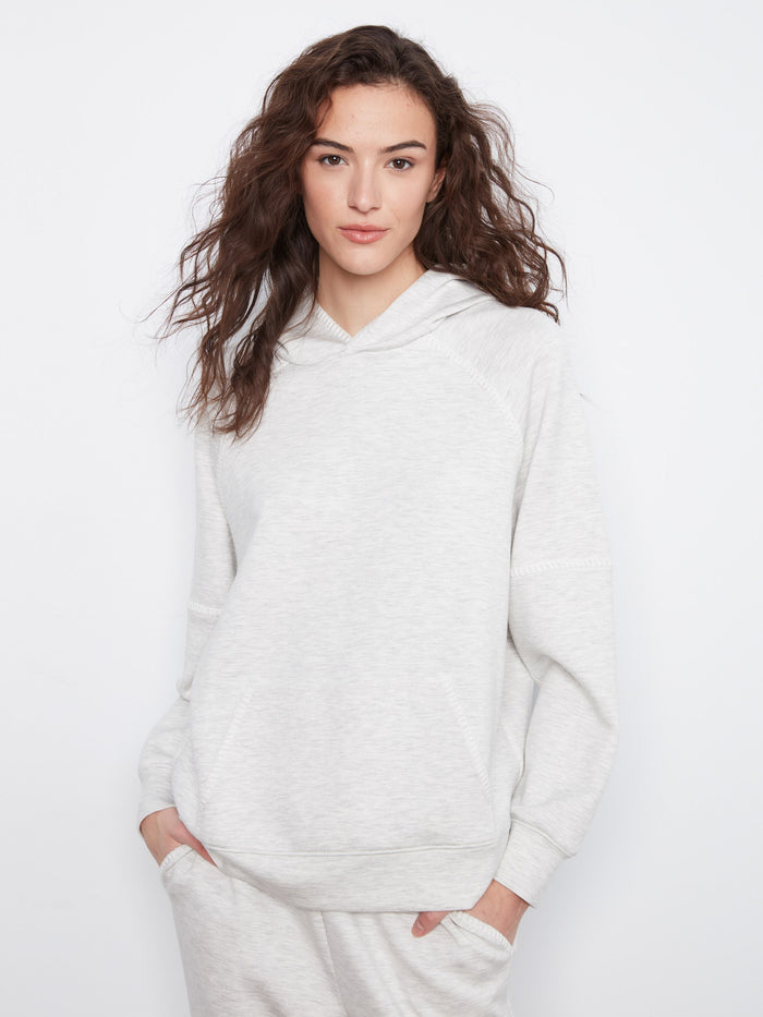 Cozy hoodie with a relaxed fit, perfect for lounging. Features a kangaroo pocket to keep your hands warm. By Charlie B.