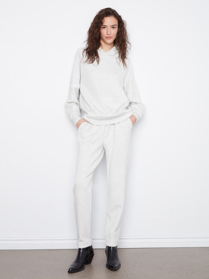 This stylish hoodie boasts a hooded design, adding extra warmth and comfort for chilly days. By Charlie B.