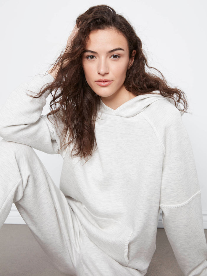 A kangaroo pocket enhances the practicality of this cozy and stylish hoodie, ideal for everyday wear. By Charlie B.