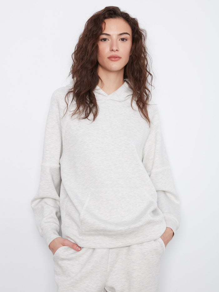 Crafted with blanket stitch details, this long-sleeve hoodie combines fashion with comfort effortlessly. By Charlie B.
