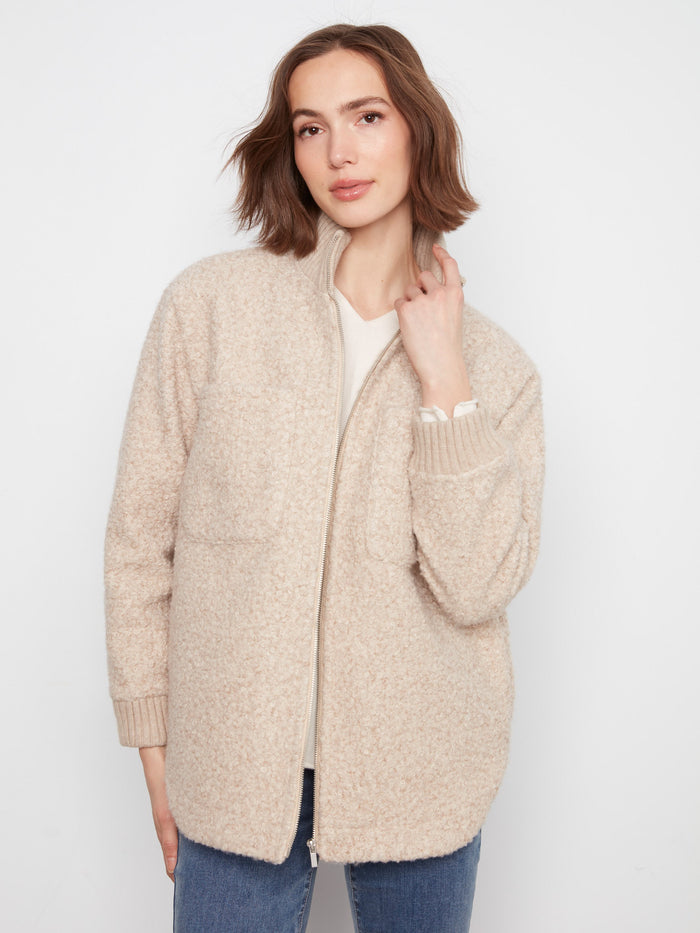 The jacket features a convenient zip-front closure, perfect for easy wear and style. By Charlie B.