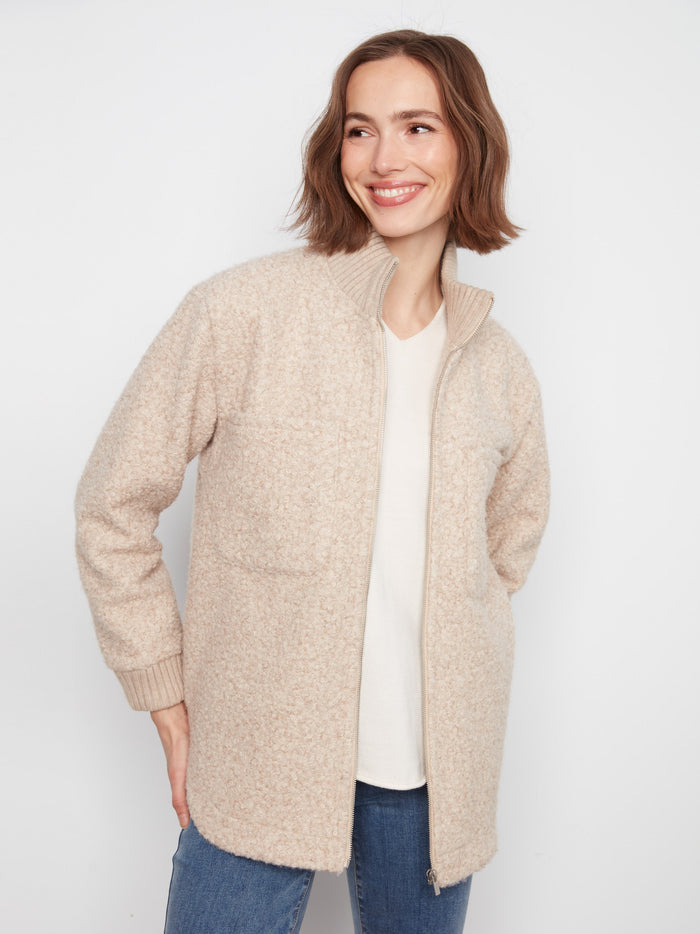 Side slash pockets enhance the practicality of this stylish and cozy jacket. By Charlie B.