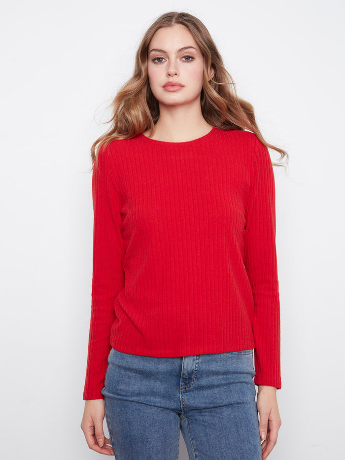 This red top features a classic crew neck design, perfect for any casual outing. The fit is both stylish and comfortable by Charlie B.