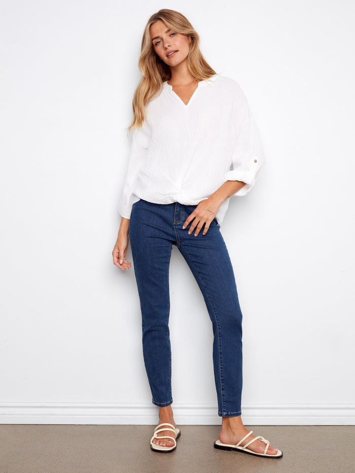 White blouse with roll-up sleeves and a chic front knot, made from breathable 100% cotton fabric by Charlie B.
