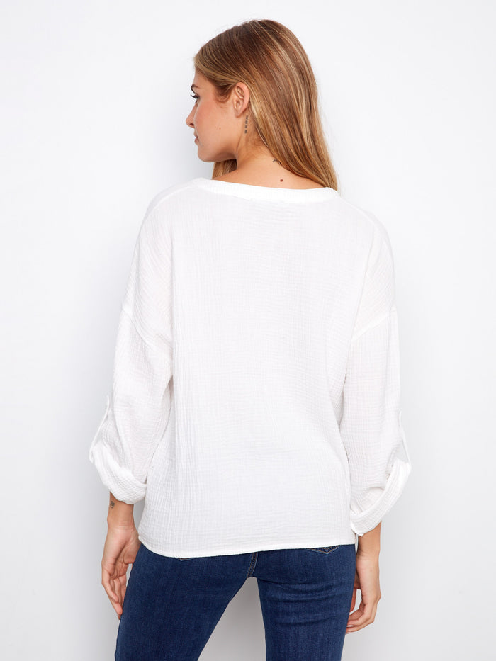 Casual yet refined white blouse with long roll-up sleeves in premium 100% cotton material by Charlie B.