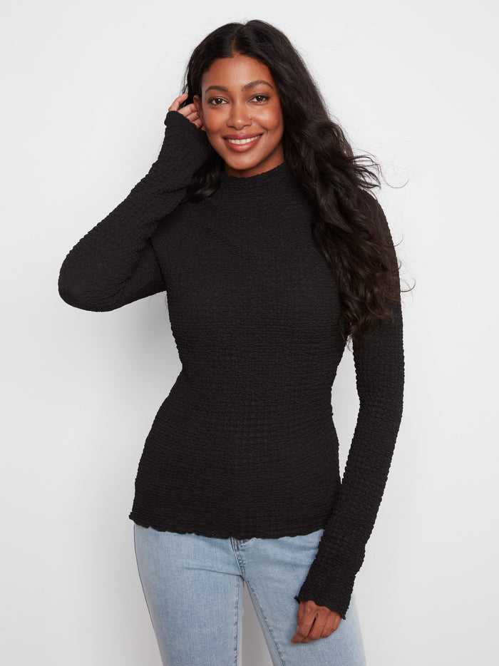 Black bubble knit top with a slim fit and long sleeves, featuring a stylish mock neck by Charlie B.