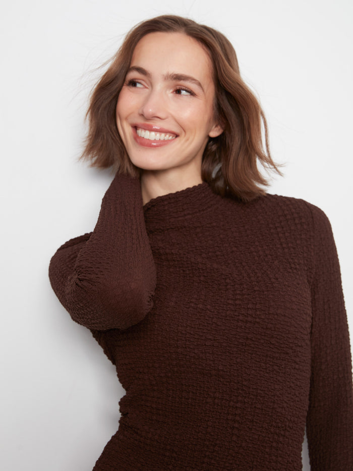 This slim fit top with lettuce-edge trim is perfect for layering or wearing on its own for a chic look by Charlie B.