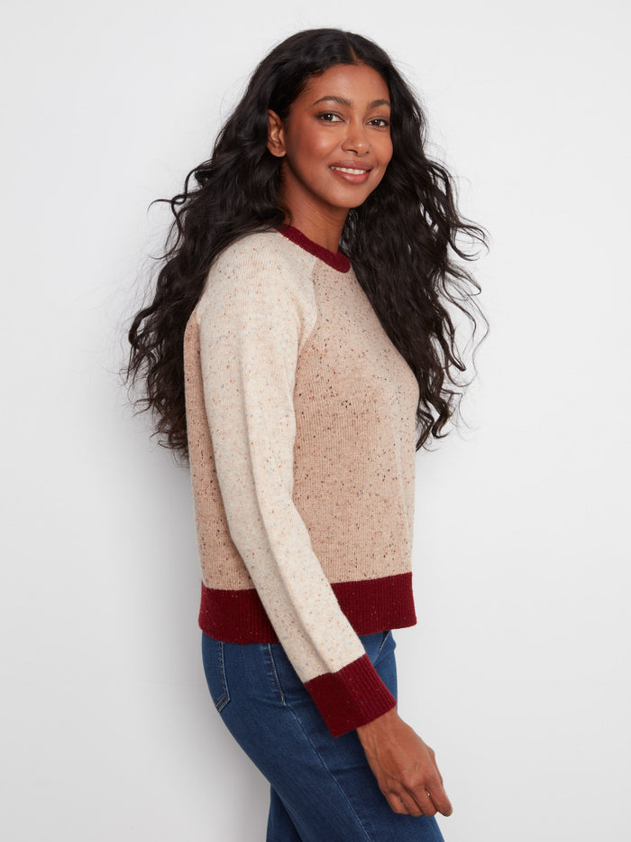 Long raglan sleeve sweater in earthy hues with a distinct speckled knit and stylish contrast trim by Charlie B.