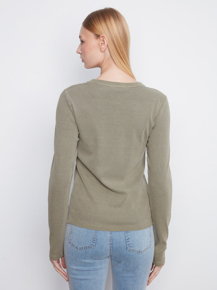 This slim-fit top in olive green offers both style and comfort for everyday wear. Designed by Charlie B.