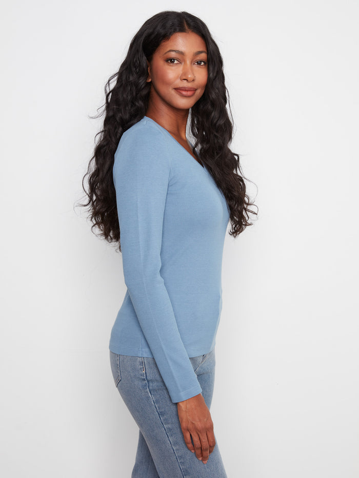 The slim fit of this top accentuates your silhouette beautifully, providing both elegance and ease in every wear by Charlie B.