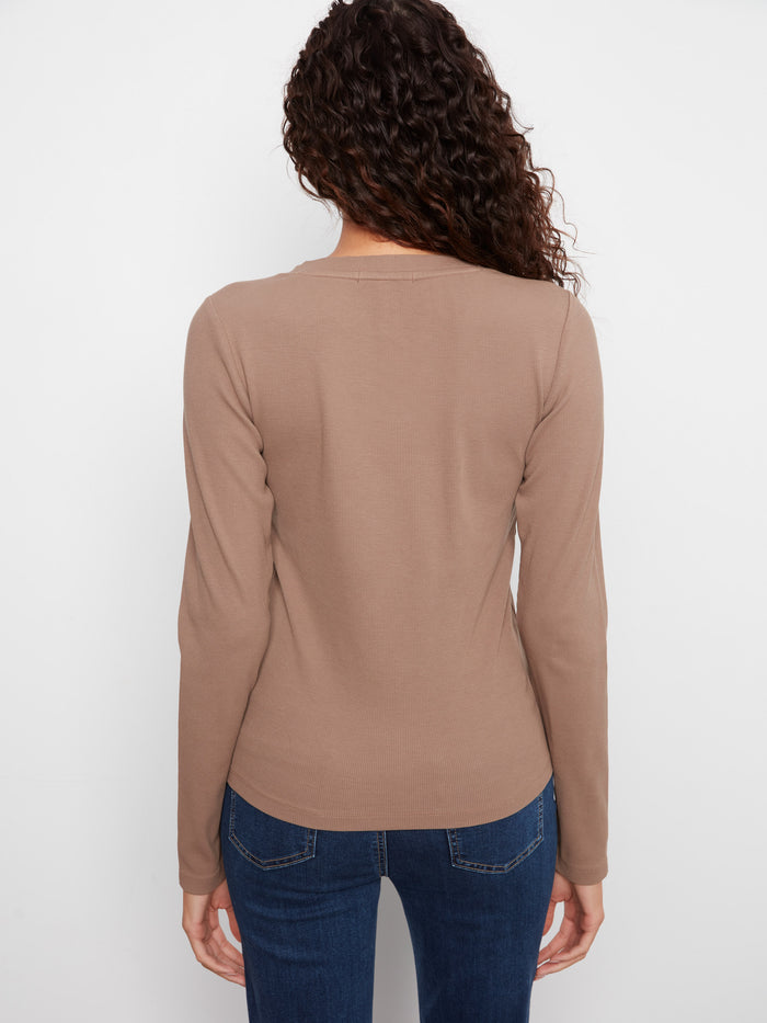 The slim fit of this ribbed top highlights the wearer's shape while providing all-day comfort by Charlie B.