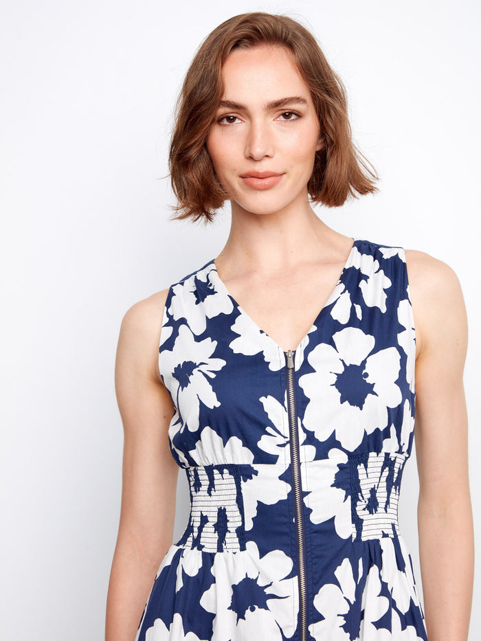 Floral pattern dress with a sophisticated V-neckline, ideal for summer outings. By Charlie B.