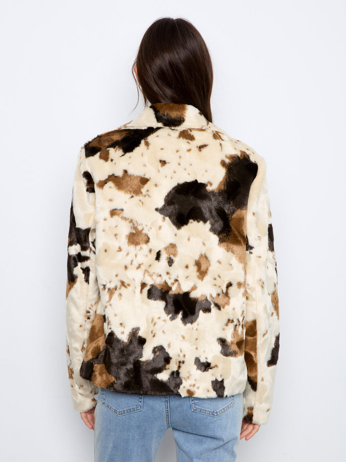 Welt pockets enhance the practicality of this chic cow print faux fur jacket by Charlie B.