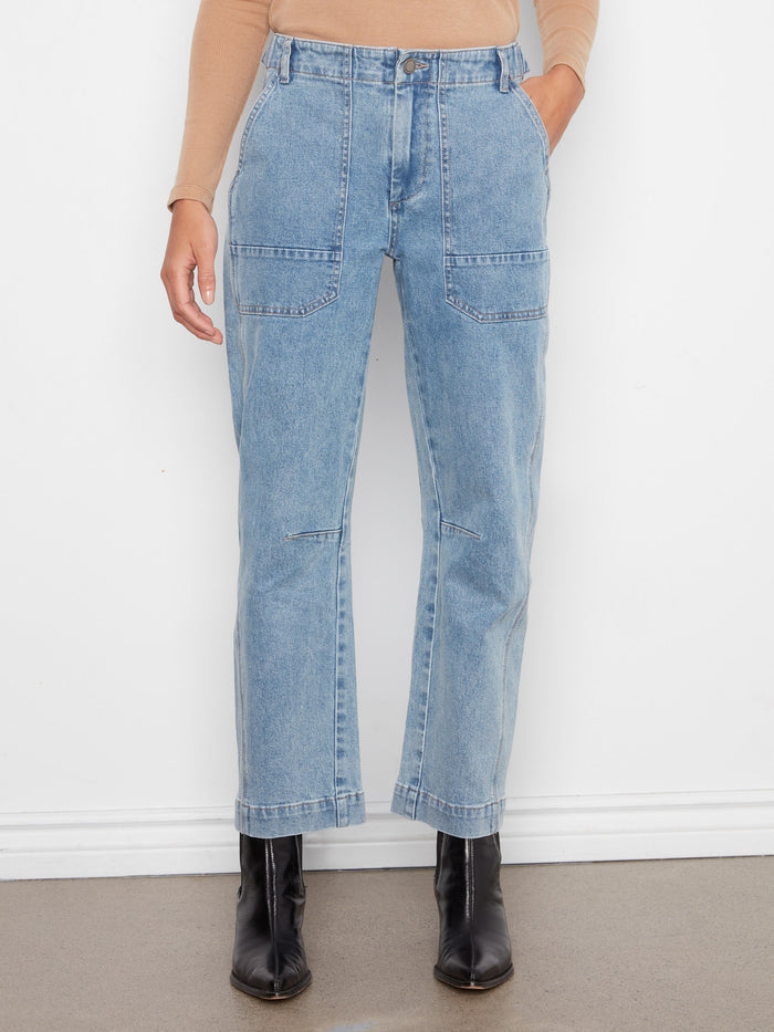 Blue stretch denim jeans featuring a regular rise and practical patch pockets, styled by Charlie B.