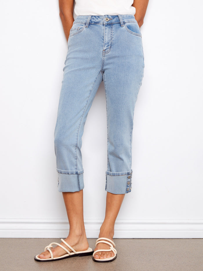 These jeans feature a unique snap button detail on the cuff, adding a touch of elegance to your look. By Charlie B.