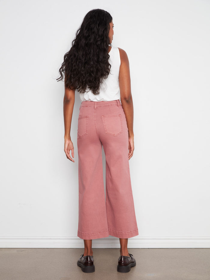 Pants with zip fly and button closure ensure secure and comfortable wear while maintaining elegance. By Charlie B.