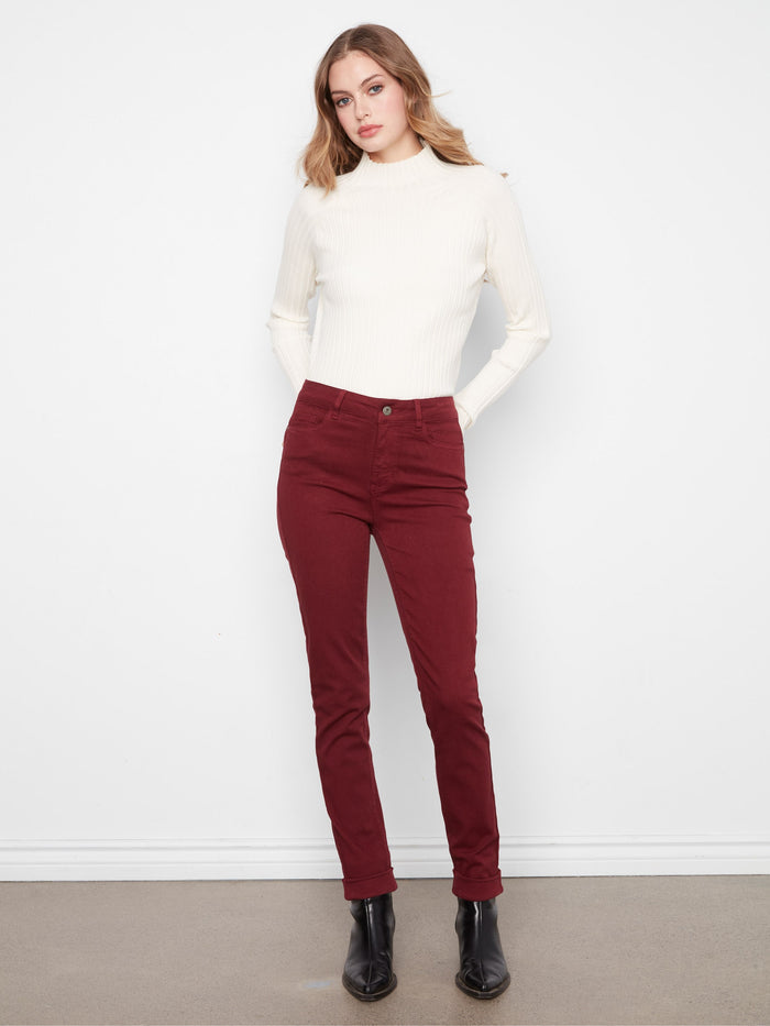 These pants feature a slim leg design, offering a sleek and modern look, perfect for any occasion. By Charlie B.