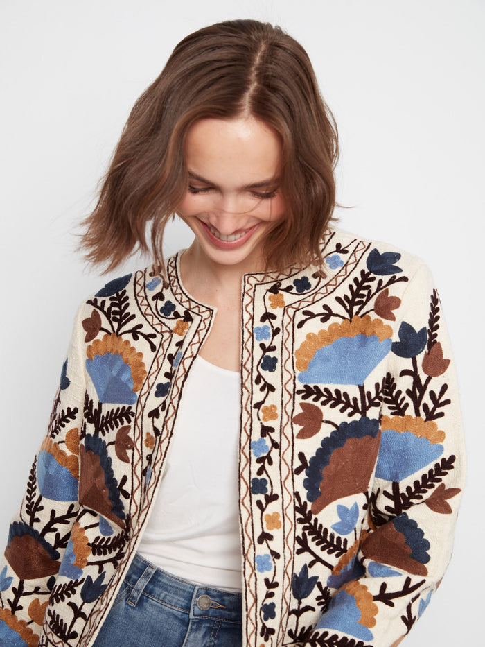 This collarless style jacket stands out with its detailed embroidery and luxurious basketweave texture by Charlie B.