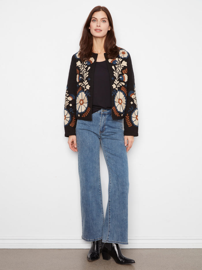 Crafted from 100% cotton, this collarless jacket combines timeless style with modern elegance in its intricate embroidery. By Charlie B.