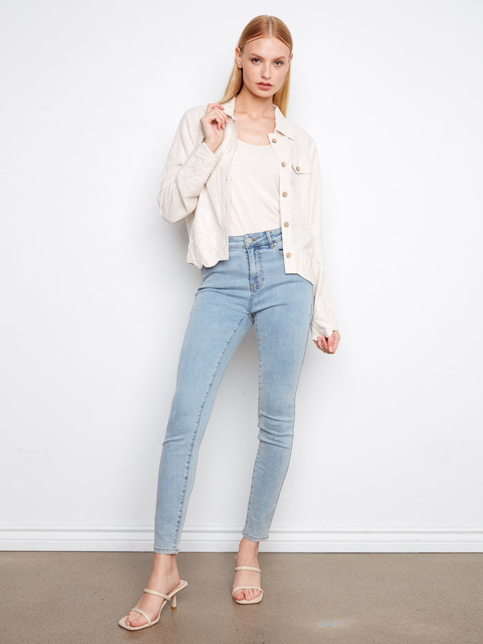 Embroidered hem and cuffs add an elegant touch to this jacket, enhancing its sophisticated appeal by Charlie B.