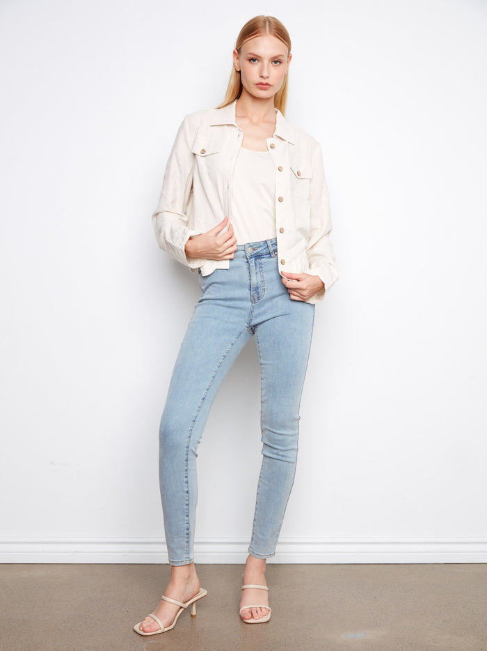 Designed with attention to detail, the faux flap pockets add charm without compromising on elegance by Charlie B.