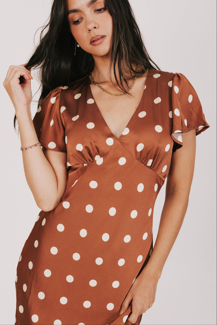 brown polka dot satin dress with flutter sleeves front