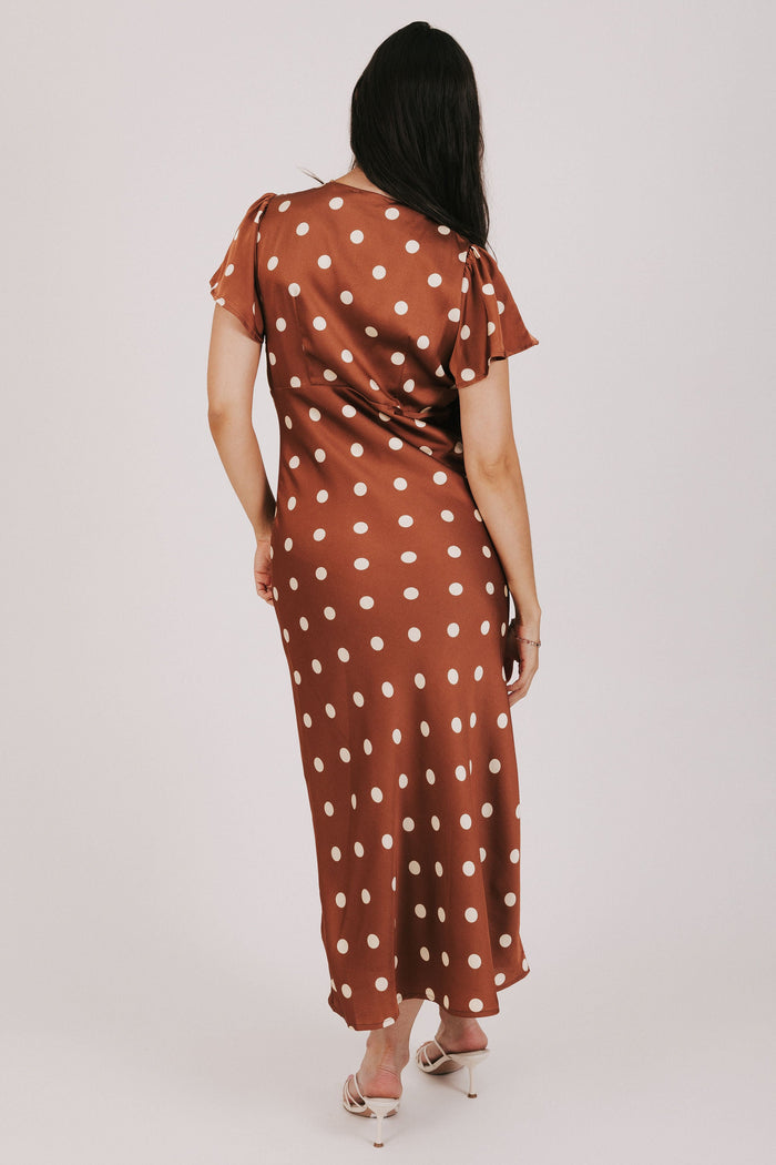 brown polka dot satin dress with flutter sleeves back