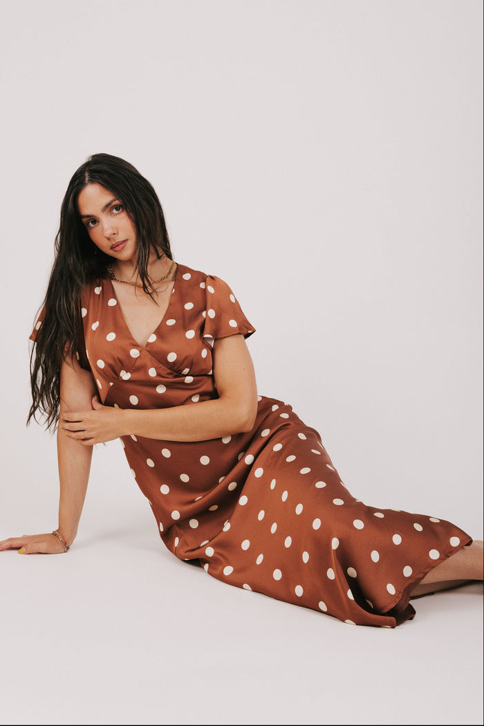 brown polka dot satin dress with flutter sleeves model