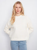 Buttercream sweatshirt featuring a relaxed fit and elegant floral soutache design, perfect for casual wear by Charlie B.