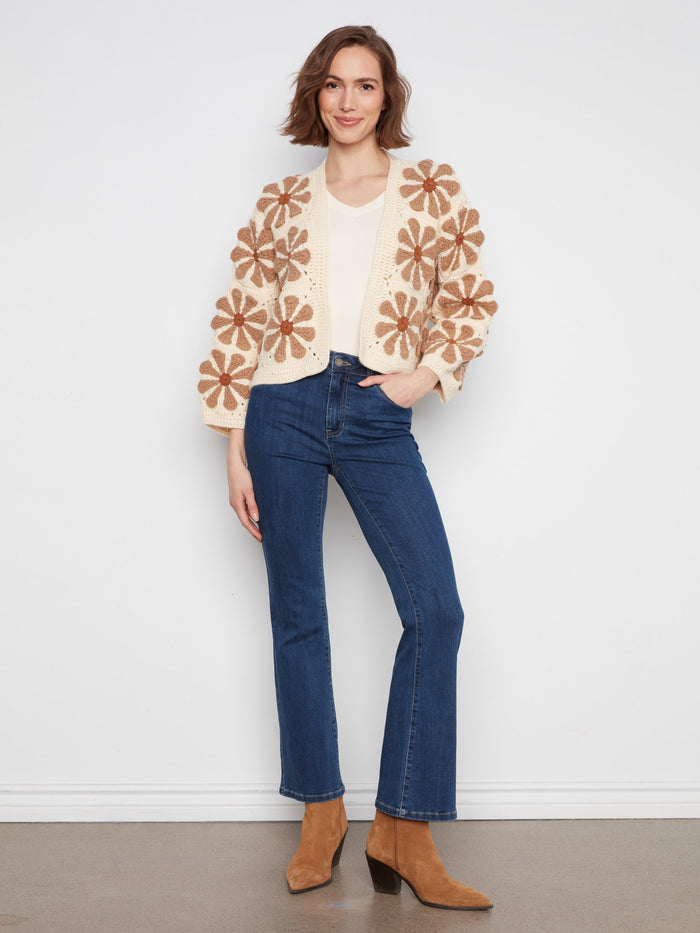 Cropped ecru crochet cardigan adorned with handcrafted floral patterns and open-front style by Charlie B.