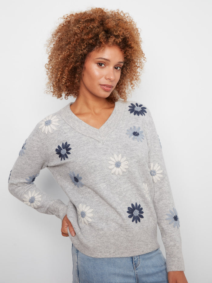 Chic heather-grey sweater with beautiful floral patterns and ribbed hem detailing by Charlie B.