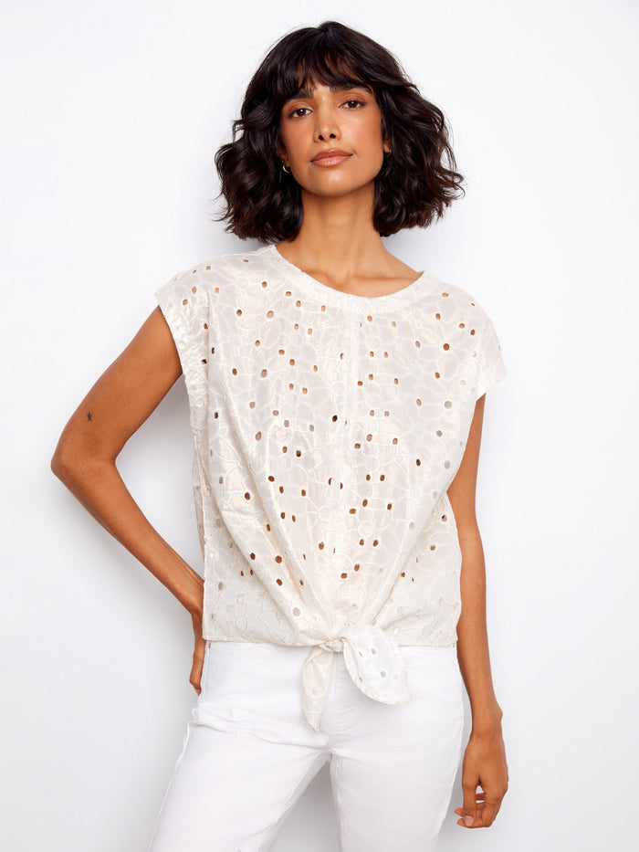 Gold foiled eyelet blouse featuring a stylish boat neckline, paired with cap sleeves for a chic look by Charlie B.
