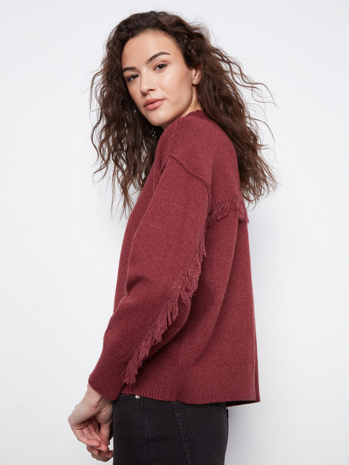 Sweater in Heather-Merlot featuring chic fringe details along the sleeves, offering a trendy look by Charlie B.