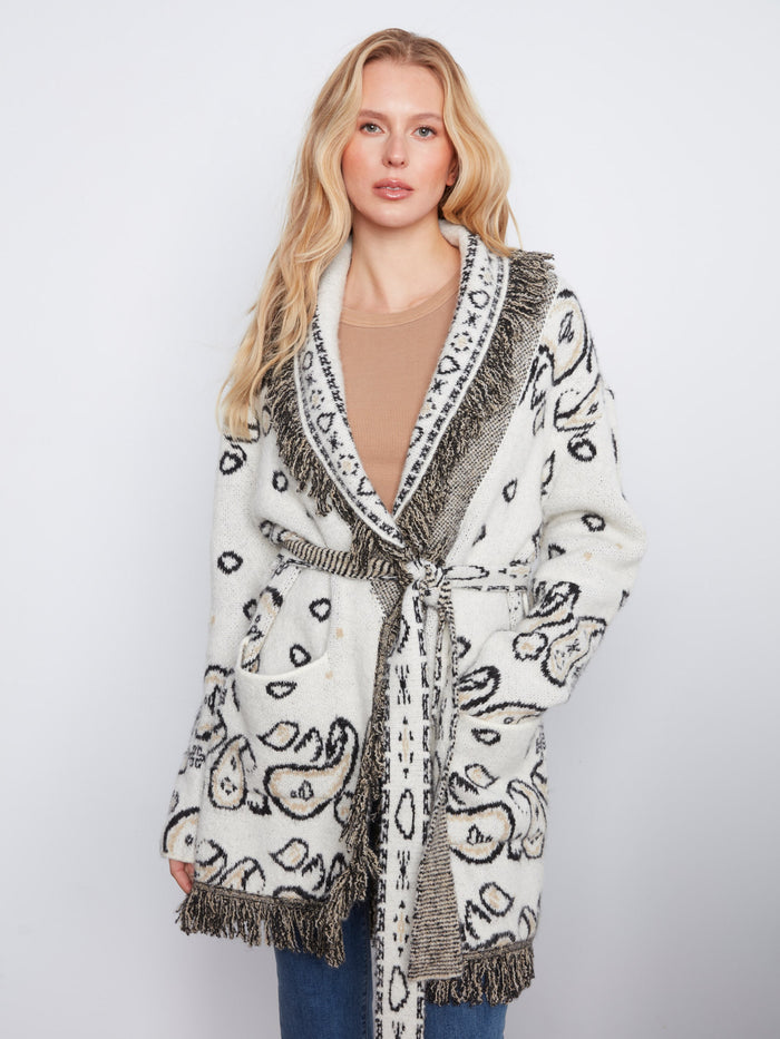 Chic self-tie belt adds a flattering silhouette to this beautifully designed coat by Charlie B.