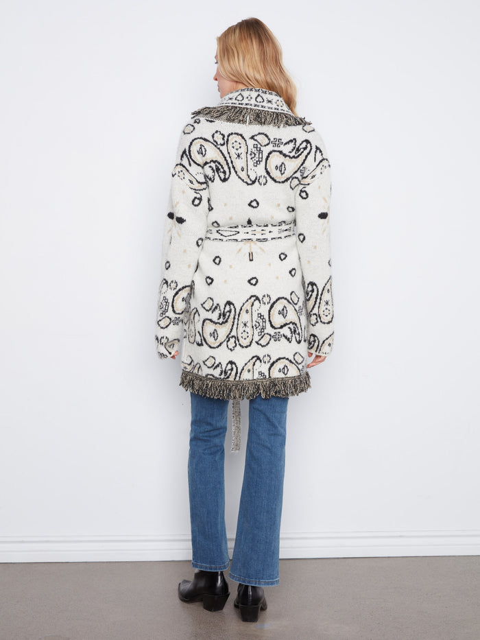 Functional patch pockets provide convenience and charm to the overall design of this coat by Charlie B.