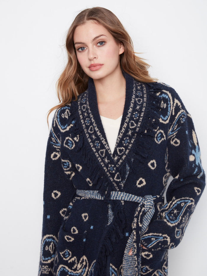 Fringe details highlight this navy blue cardigan's geometric jacquard pattern, offering both style and comfort by Charlie B.