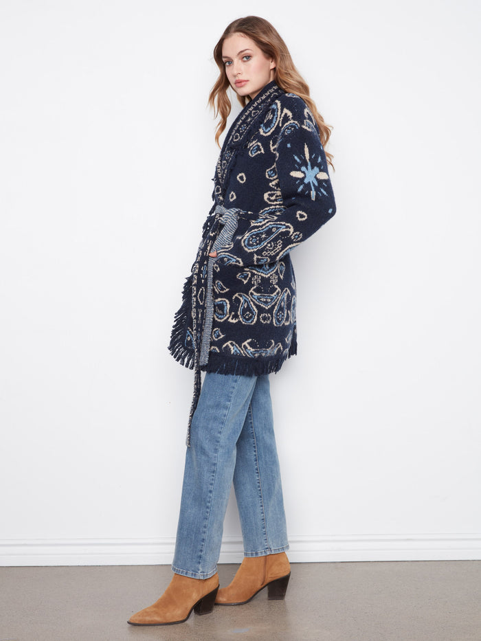 Patch pockets enhance the practicality of this navy blue fringed cardigan with a chic geometric pattern by Charlie B.
