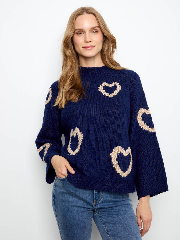 Navy sweater with mock neck and heart patterns, featuring 3/4 bell sleeves for a stylish touch by Charlie B.