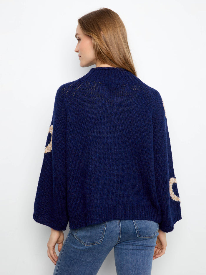 Stylish navy knit with a relaxed fit and cute heart accents, ideal for cozy days out by Charlie B.