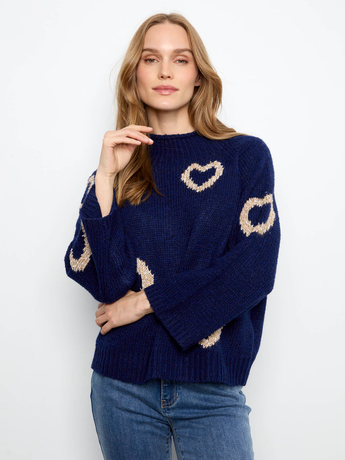 Trendy mock neck navy sweater featuring eye-catching hearts and comfortable 3/4 bell sleeves by Charlie B.