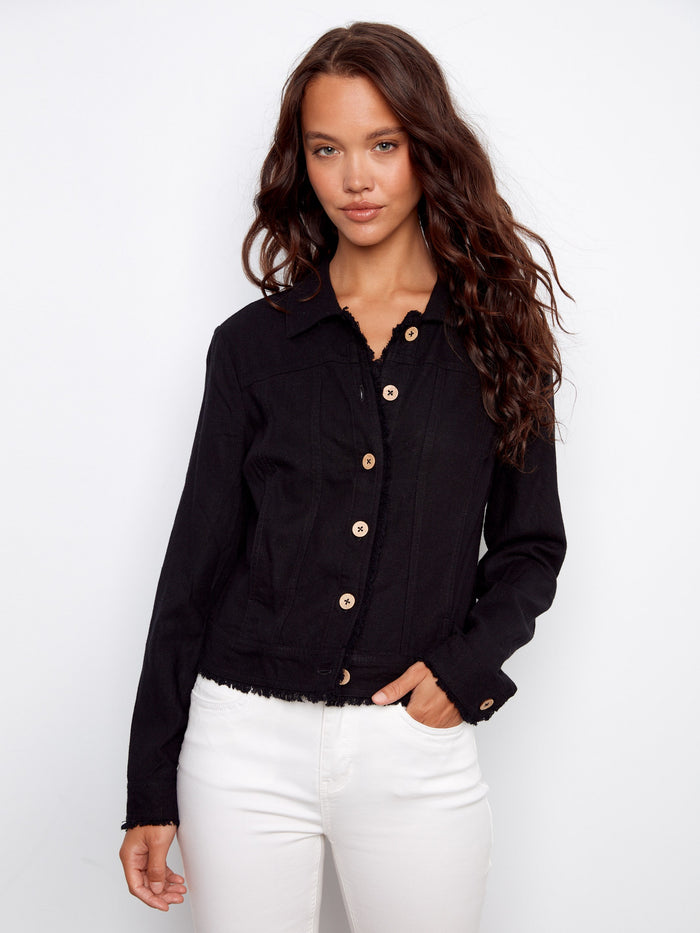 The front button closure on this chic jacket offers convenience and style, making it a staple piece for any outfit. By Charlie B.