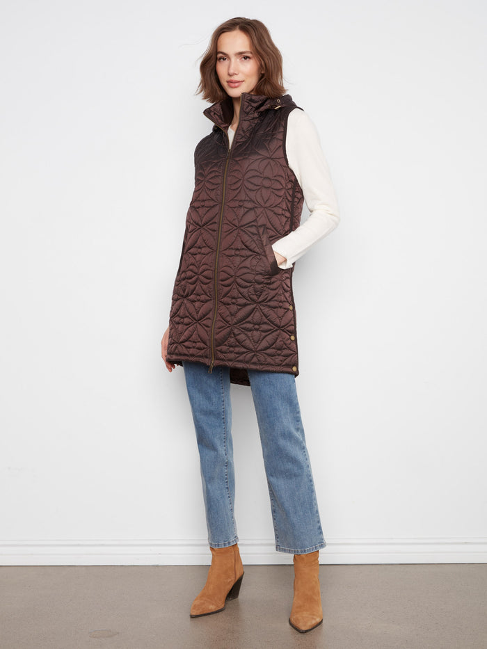 Quilted design vest with a sleek zip-front closure, perfect for layering in cooler weather. By Charlie B.
