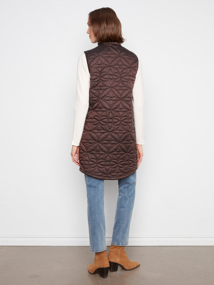 Side snap buttons add a touch of versatility to this stylish quilted vest, ideal for adjustable comfort. By Charlie B.