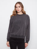 Charcoal top featuring drop shoulders and floral applique, crafted from stretch cotton by Charlie B.